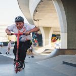 boy-in-gray-cap-riding-kick-scooter-2425569